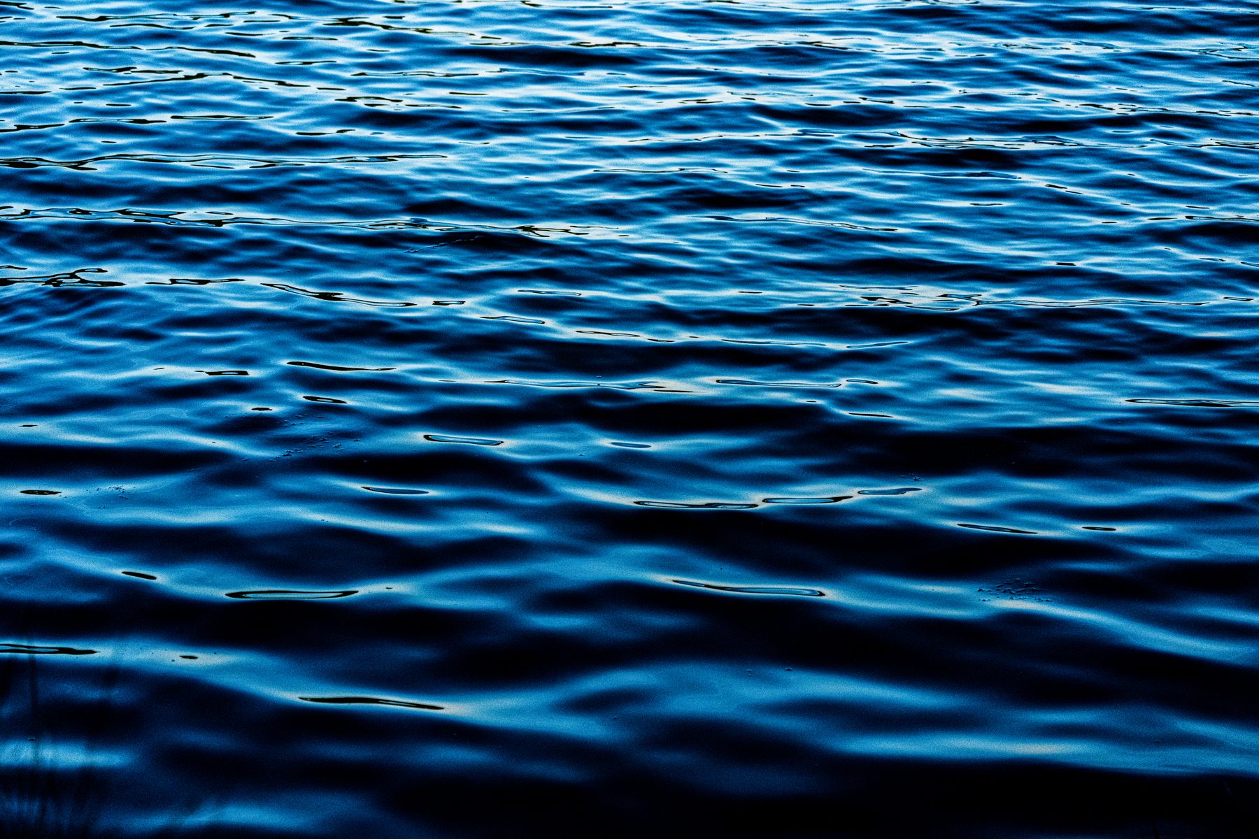 Close study of evenly rippled blue open water